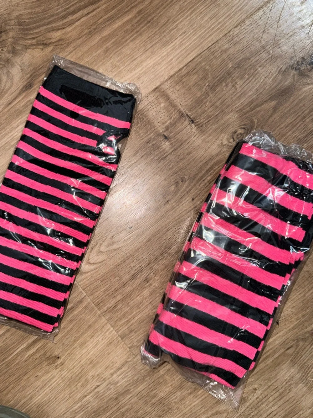 Brand new pink and black sock/arm warmer set